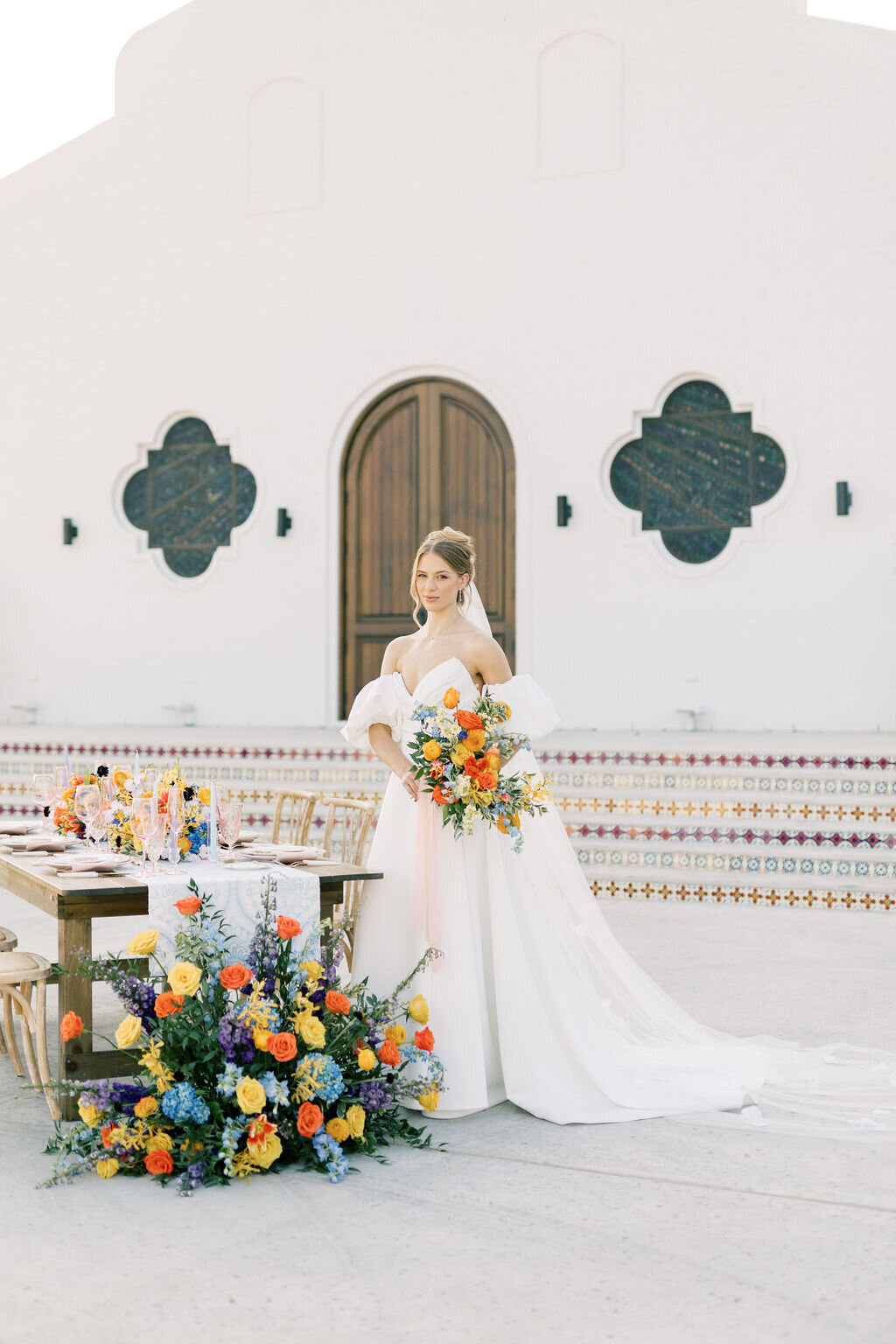 A garden-inspired tablescape with elegant floral arrangements and bright colorful hues.