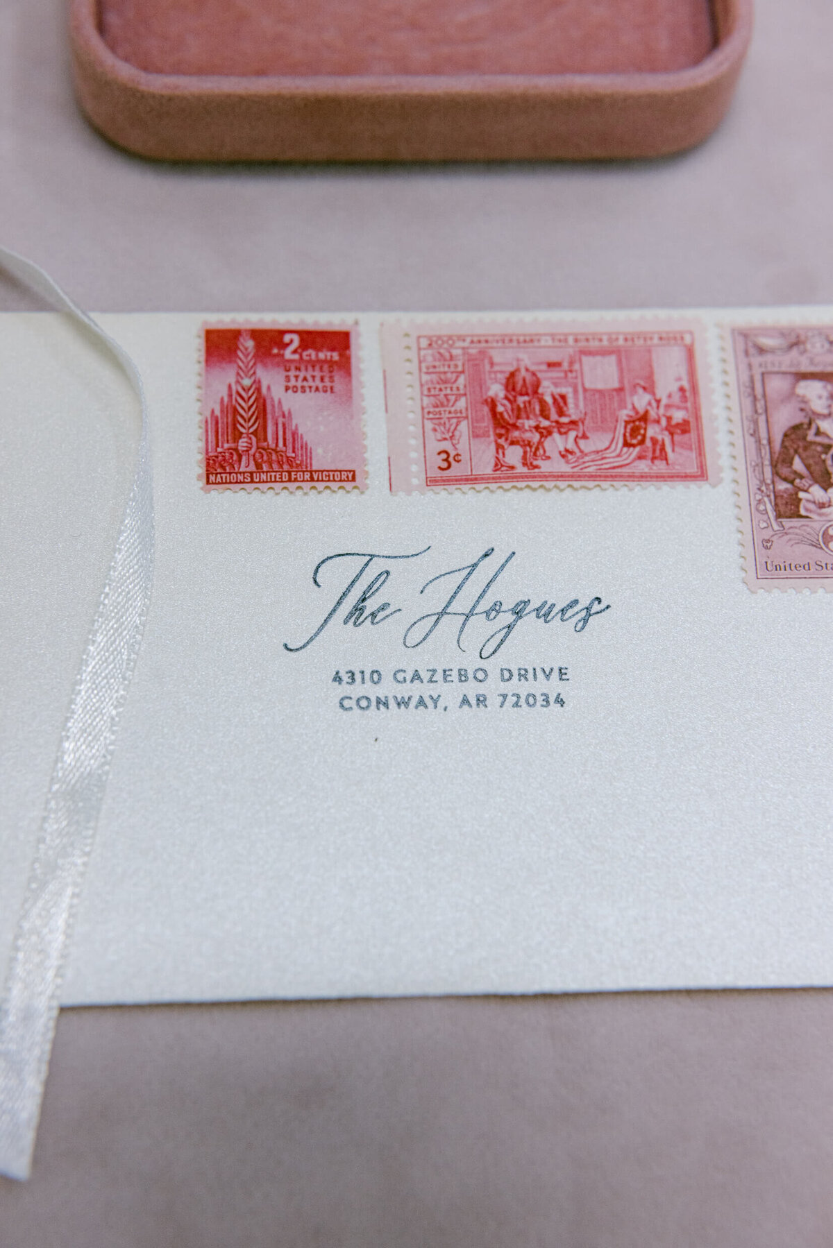 A wedding photo of the couples wedding invitation