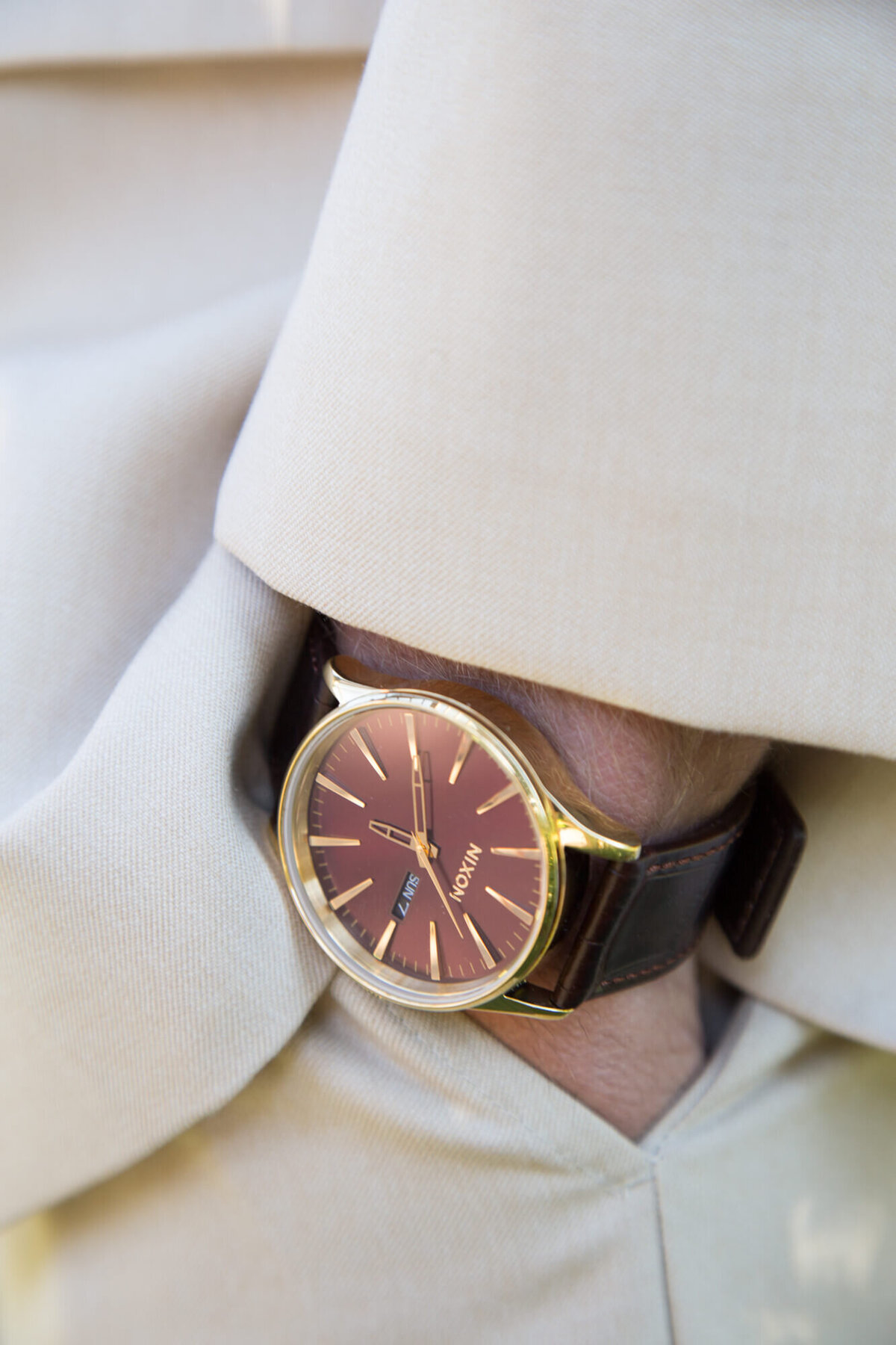 wedding detail of groom wearing a nixon watch