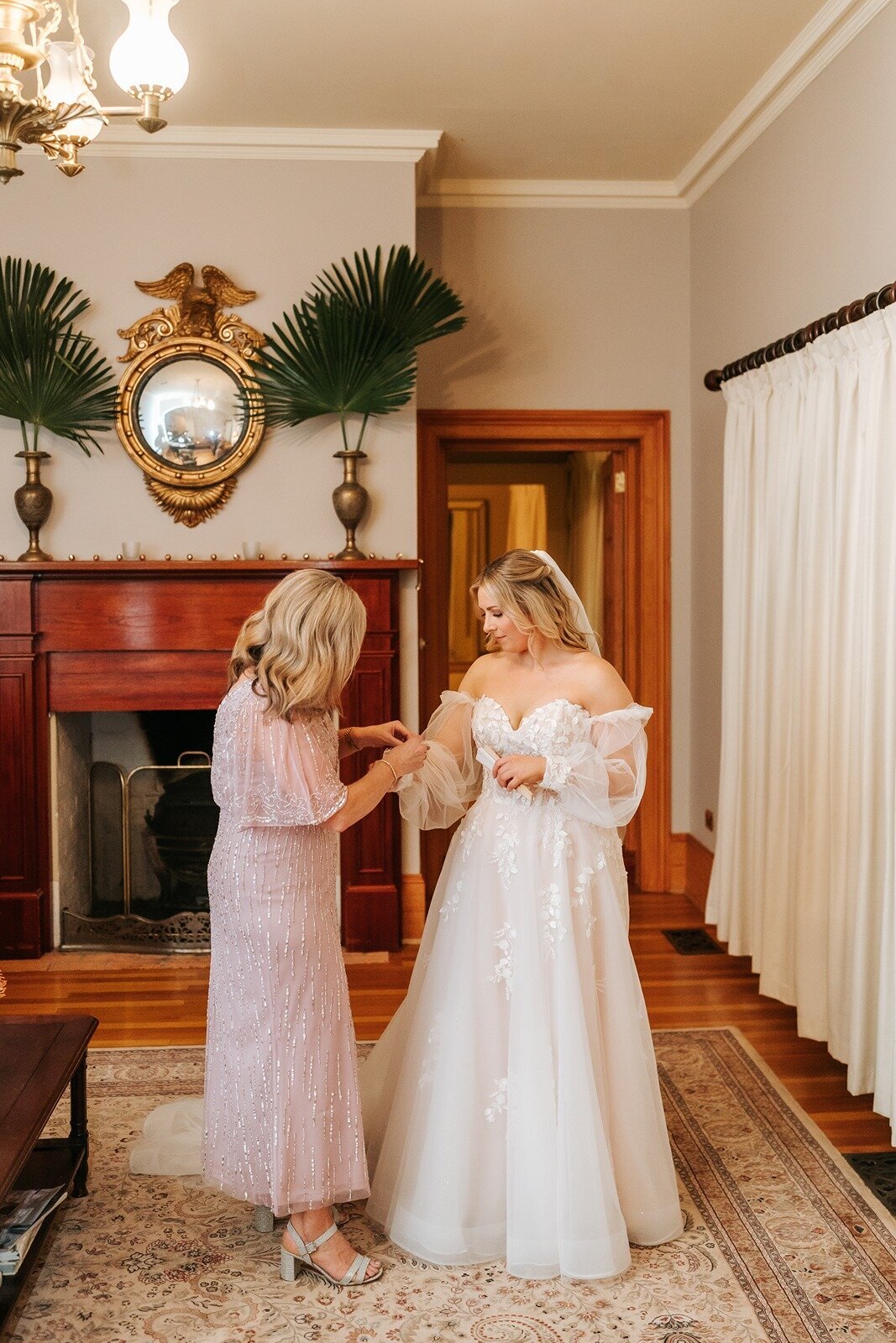 Bride getting ready for her microwedding with her mother in rural Victoria