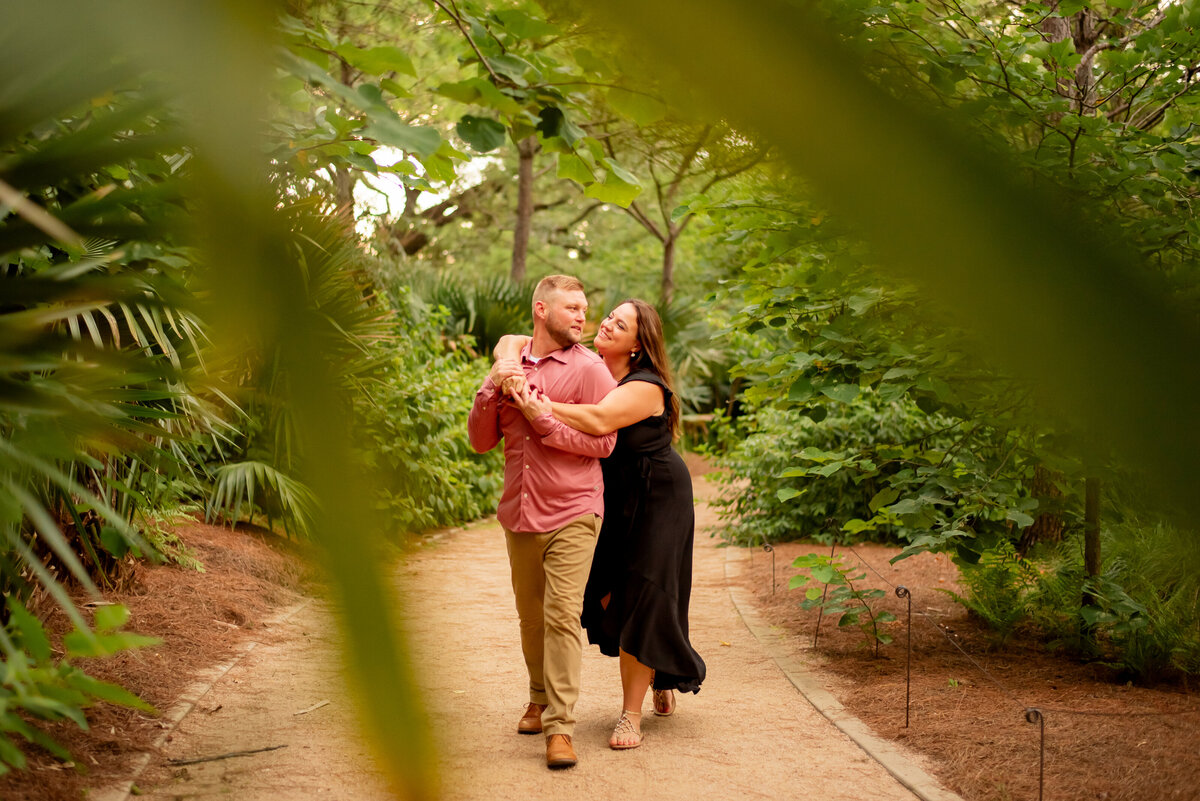 Discover the journey to forever as this engaged couple walks hand in hand along the picturesque paths of McGovern Centennial Gardens in Houston, Texas.