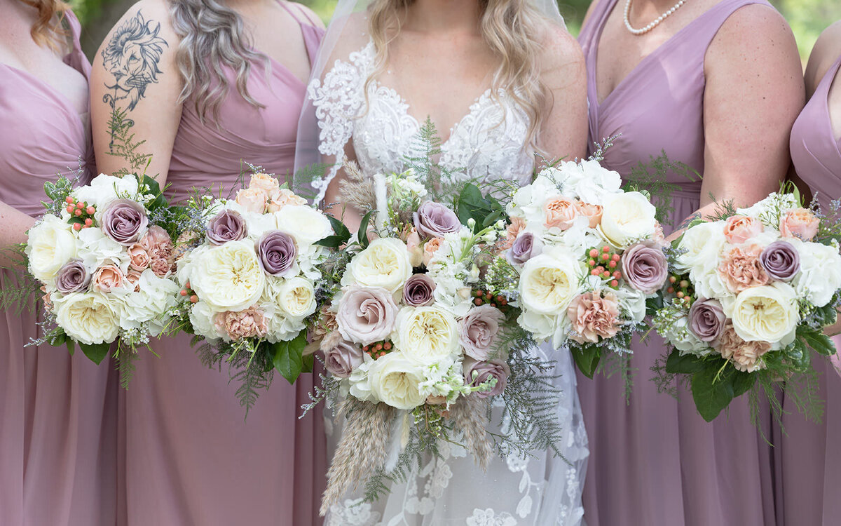 Bridesmaids with white flower bouquets in a St Augustine Wedding