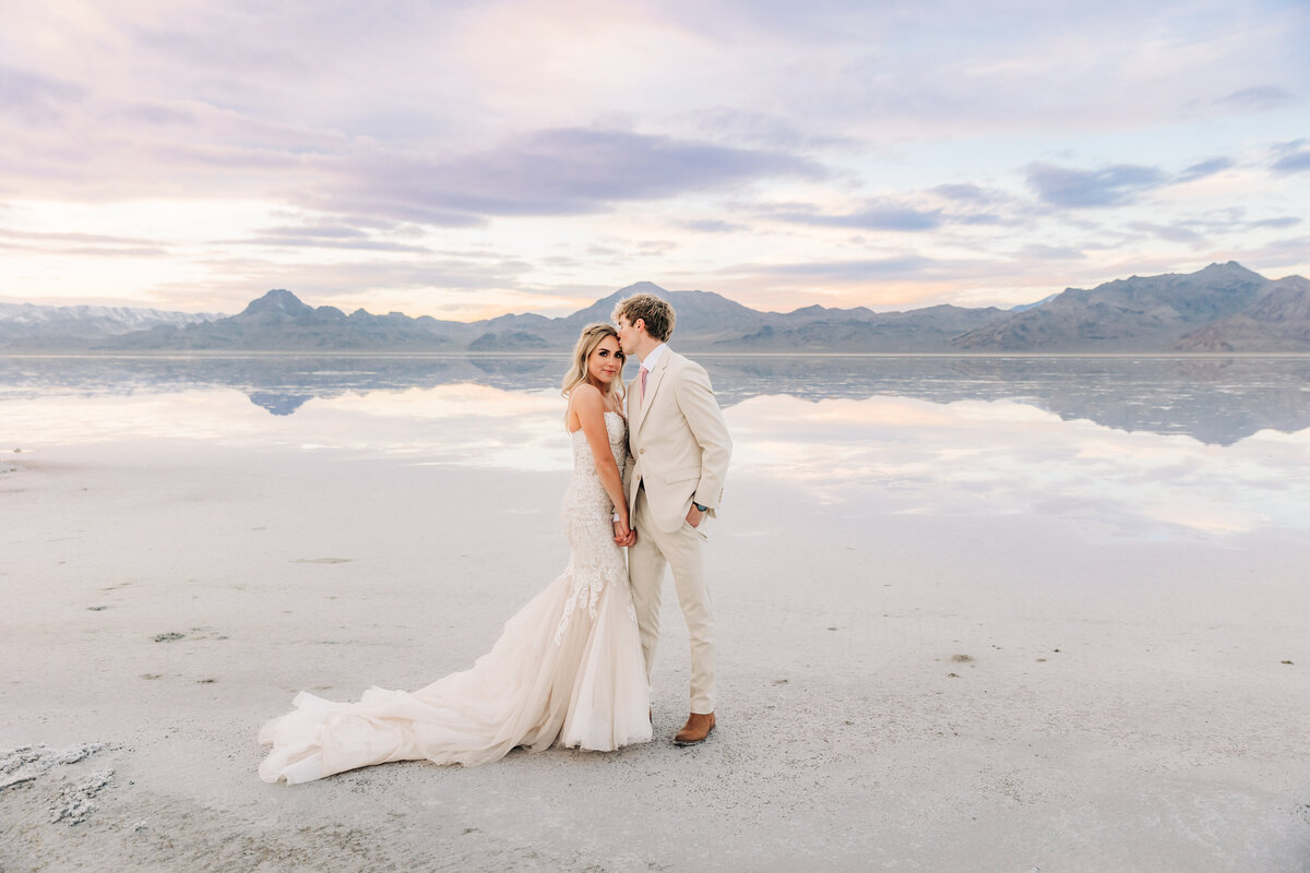 Newlywed couple posing for wedding photos at the Salt Flats'