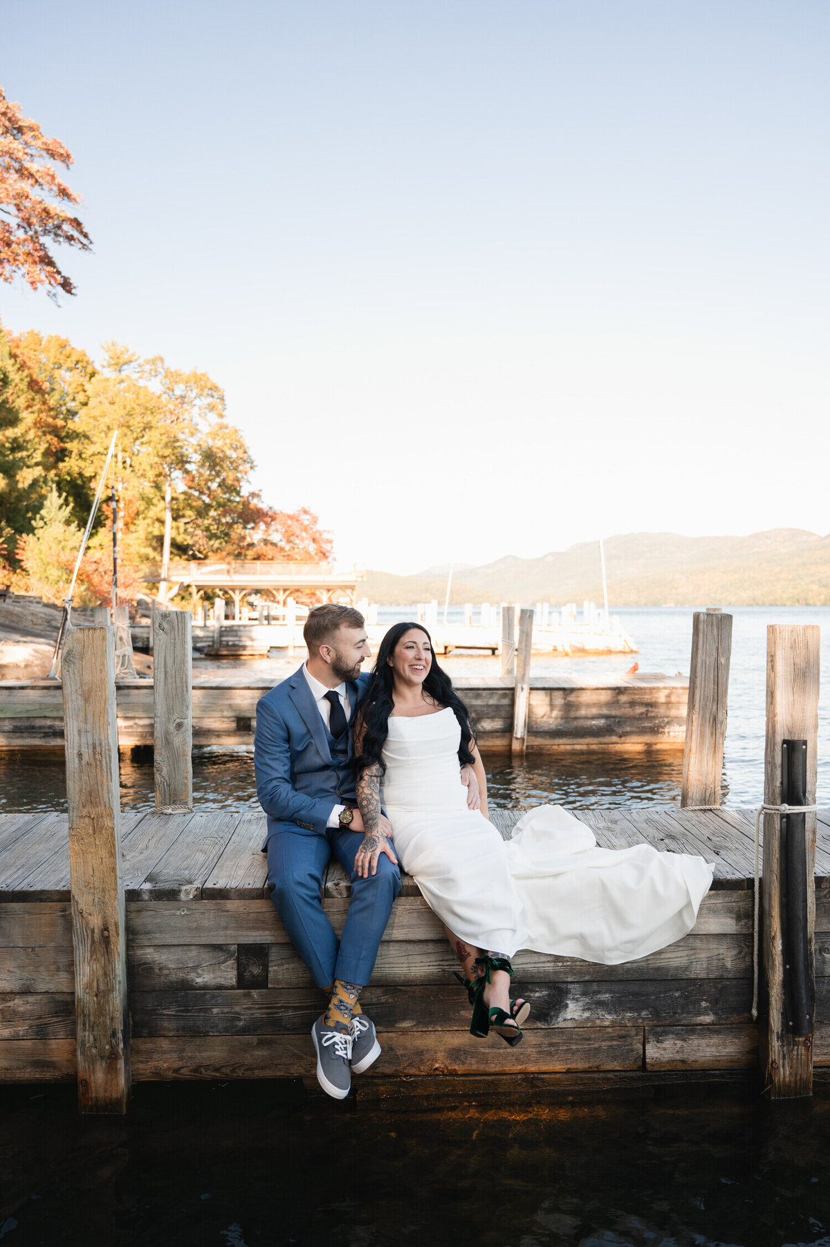 The bride and groom taking in the views of Lake George before their backyard wedding in the Adirondacks at the Sagamore Golf House.