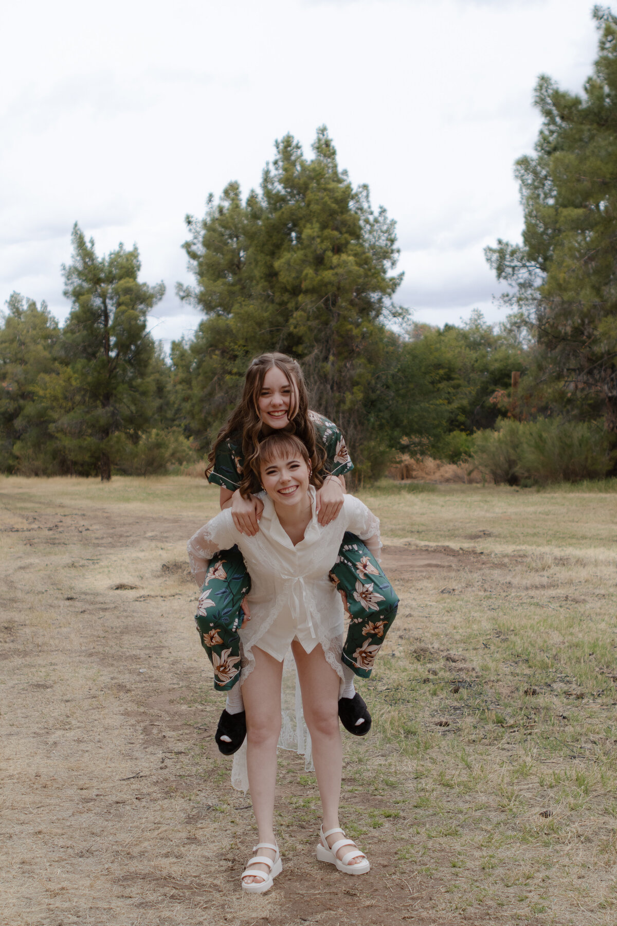 Jovanna G Photography. Classic, sophisticated Wedding Photos. Soft romantic engagement photos. Soft romantic WeddingPhotos. Sophisticated Wedding Photographer. Professional Wedding Photographer. Destination Wedding Photographer. Luxury Wedding photographer. Traveling Wedding Photographer. AZ Wedding Photographer. Gilbert AZ Wedding Photographer. Queen Creek Wedding Photographer. Phoenix Wedding Photographer. Scottsdale Wedding Photographer. Flagstaff Wedding Photographer. SoCal Wedding Photographer. California Wedding Photographer. Northern California Wedding Photographer. Southern California Wedding Photographer. San Francisco Wedding Photographer. Bay Area Wedding Photographer. San Jose Wedding Photographer. Golden Gate Bridge Wedding Photographer. Beach Lover Wedding Photographer. Palace of the Fine Arts Wedding Photographer. Ocean Lover. I love California. Orange County Wedding Photographer. Newport Beach Couples Photographer. Newport Beach Wedding Photographer. Laguna Beach Couples Beach Engagement Photographer. Laguna Beach wedding beach photographer. Los Angeles Wedding Photographer. Young and in love engaged couples who live in southern California. Christian Young Couple. Young Engaged Couple. Engaged High School Christian Couple. Christian Values. Young conservative Christian women. Young Conservative Christian men. Young Conservative Christian Couple. Young Christian Couple Engaged in High School. Young Christian College Couple. Forest, Flora Wedding for the Fergusons. Arizona Flagstaff Wedding. Arizona Flagstaff Wedding Cloudy, Rainy day. Detail Flatlays. Details Checklist. Vow books. Ring box. Jewelry. Florals. Groom’s Details. Hunter and Julia Forest pine tree wedding. Pine Top Cloudy Rainy day Wedding day. Pine tree mountain wedding. California pine mountain tree wedding day. Outdoor rainy day wedding in the mountains. Mountain top pine tree outdoor spring wedding. Green bridesmaids dresses. Fun wedding party. Venue at Schnepf Farms. Wild Blume Florals. Makeup by Laly Harr. David’s Bridal. Womack Services AZ. Inspired Sugar Cake.