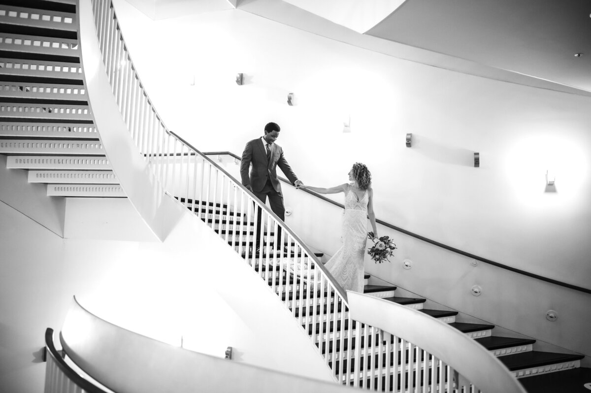 Interracial couple walk down the stairs at the MCA in Chicago