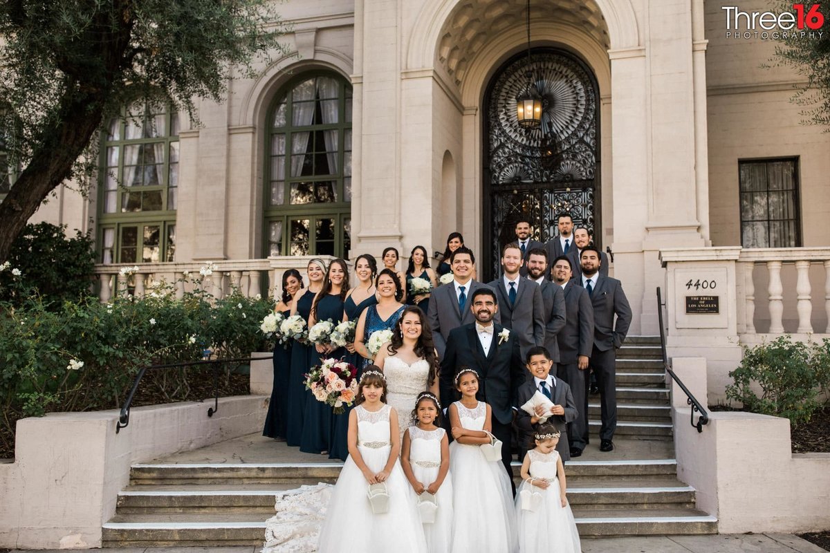 Entire Wedding Party poses for photos in front of the Ebell in LA