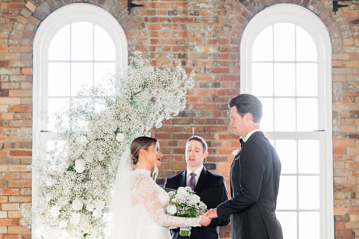 bride and groom saying vows