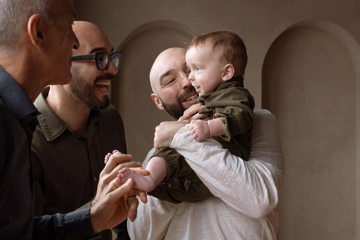 extended family photos with newborn baby in studio