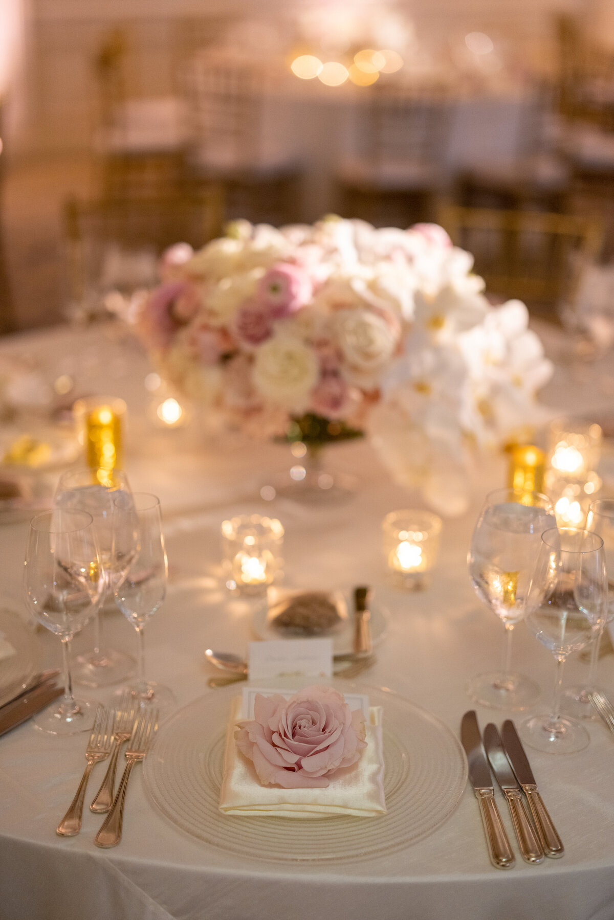 pink and white rose and orchid centerpiece