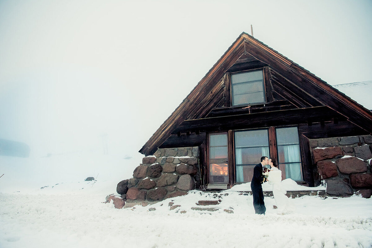 bride and groom in snow