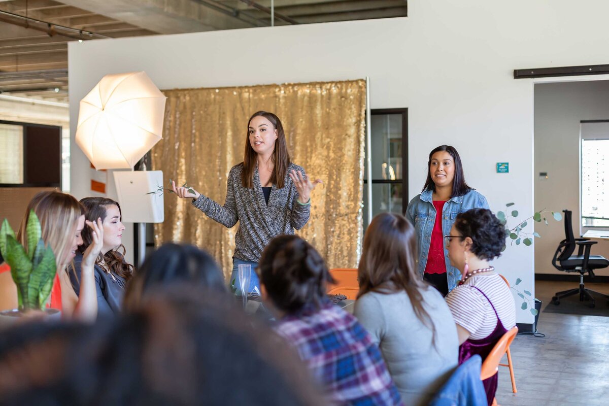 Elegant and professional branding events photography by Sophie K. Hunter featuring a female speaker at a corporate event in Dallas, TX.
