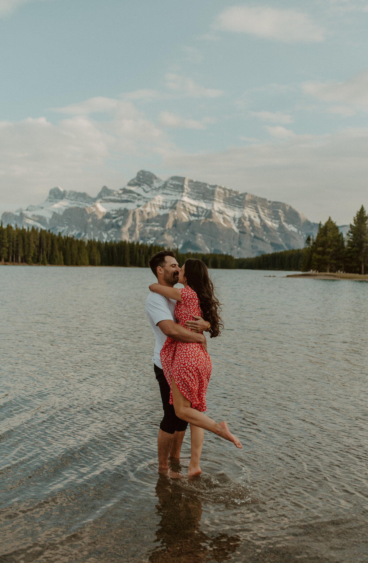 engagement couple in lake in Banff National Park