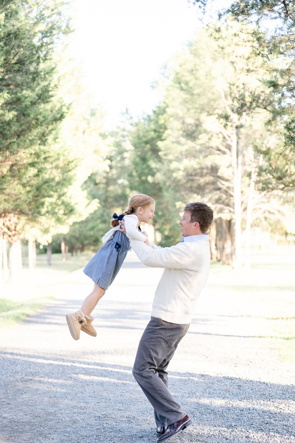 dad twirling daughter taken by Sterling, Virginia family photographer