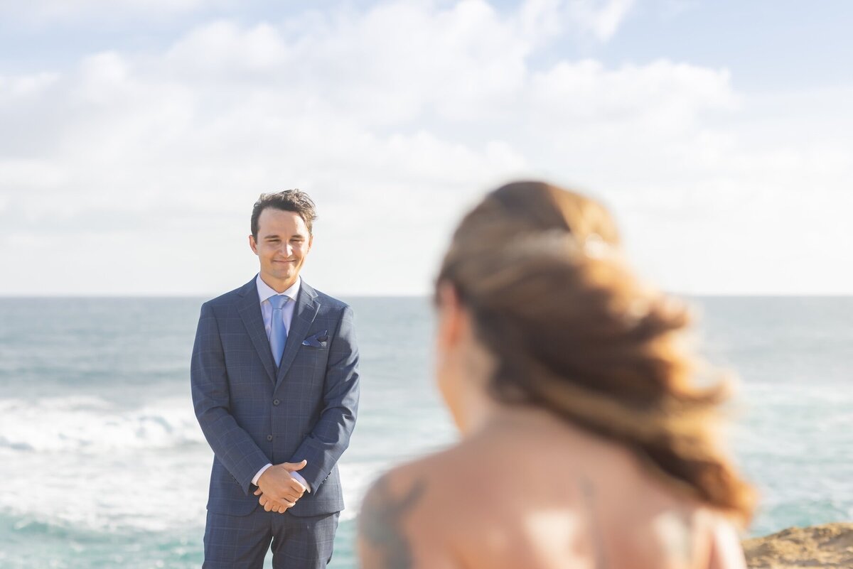 Groom’s reaction beautifully caught by a Kauai wedding photographer