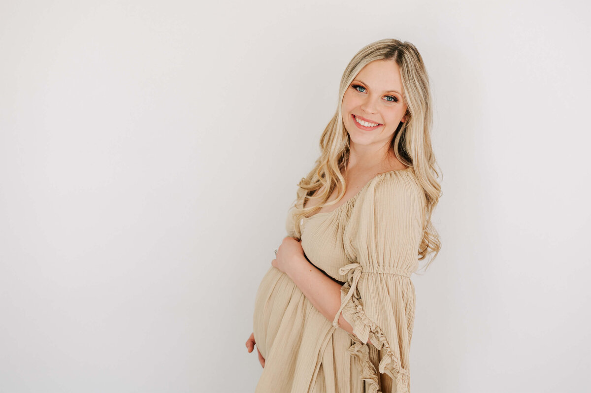 pregnant mom smiling and enjoying maternity photography in Springfield Missouri