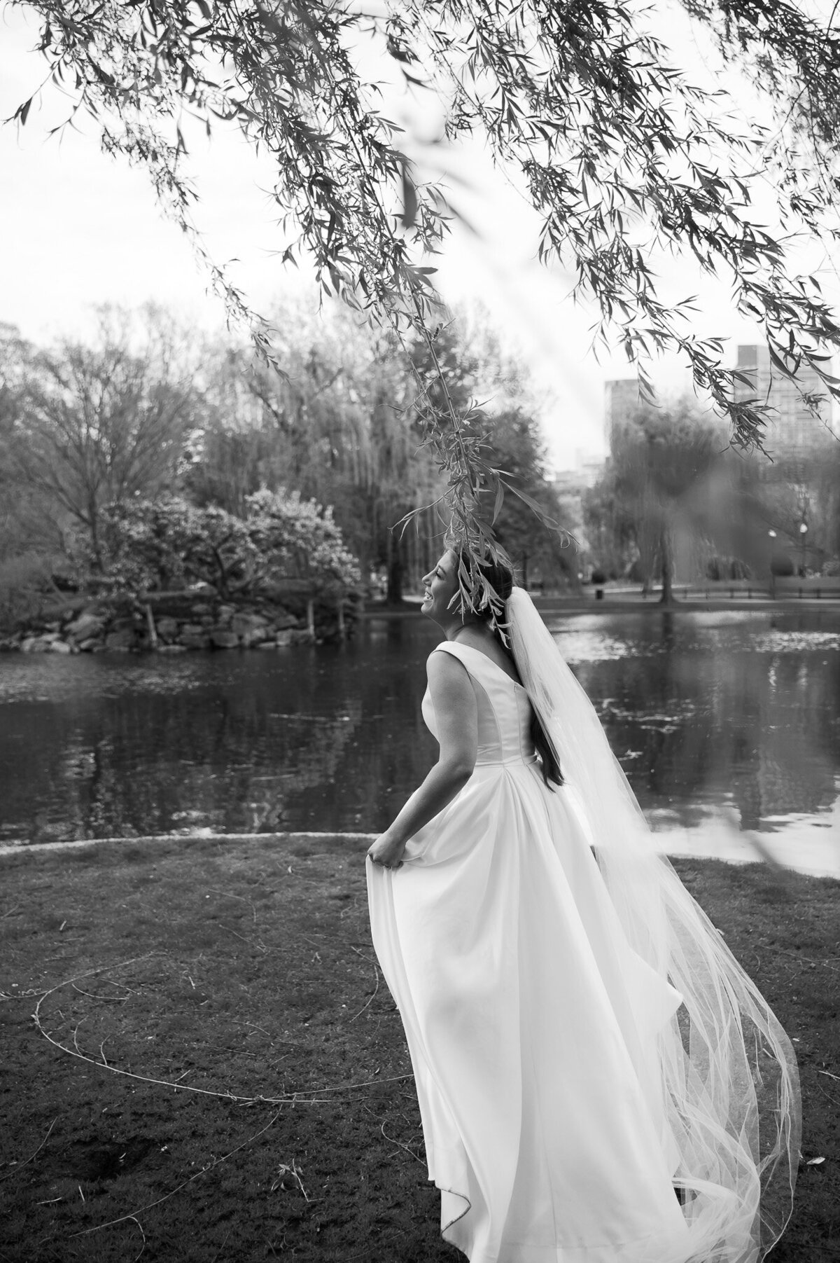 bride standing by the water