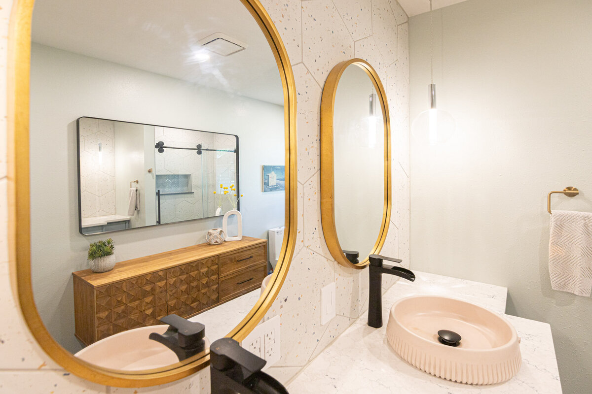 oval mirrors over sink