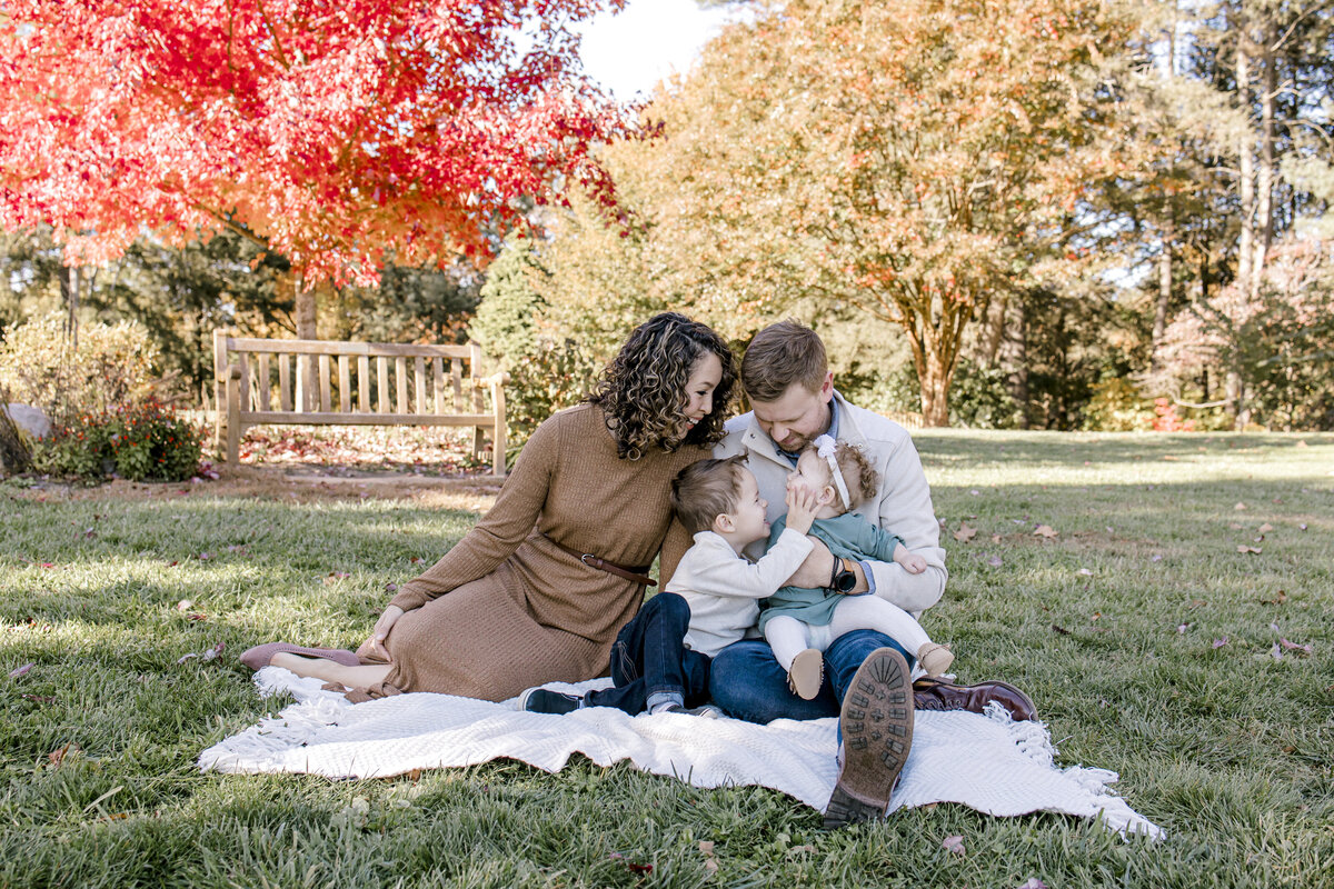 Family on a blanket fall foliage