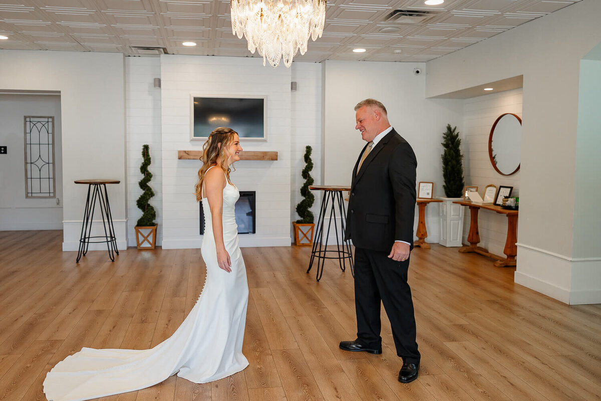 The bride and her father while he see’s her for the first time in dress during a wedding in Colorado Springs