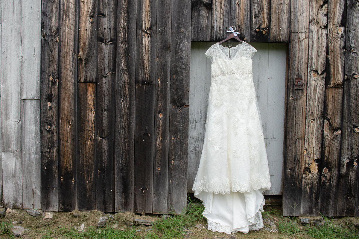 Wedding dress hanging on a barn in Dayton Maine