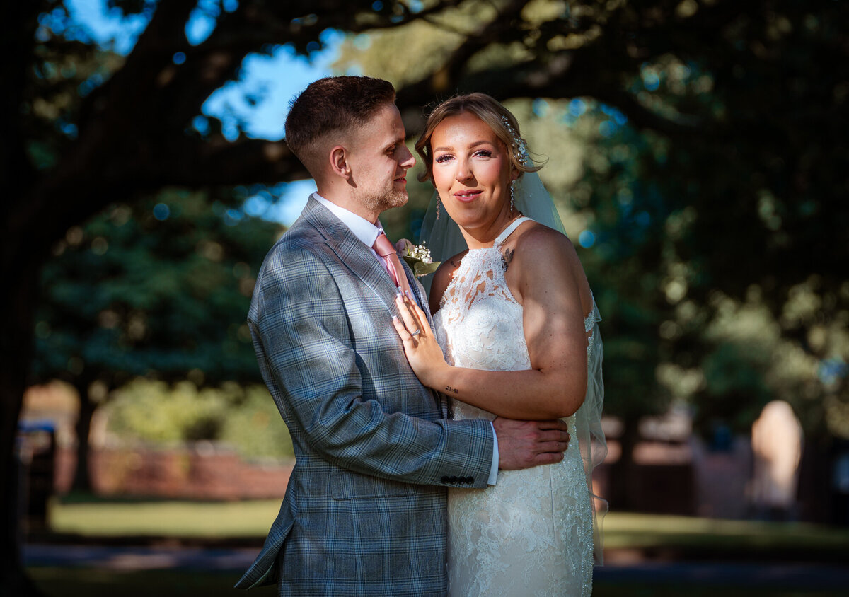 Couple romanticly posing in Astley Park by Anthony Horseman Photography and Film