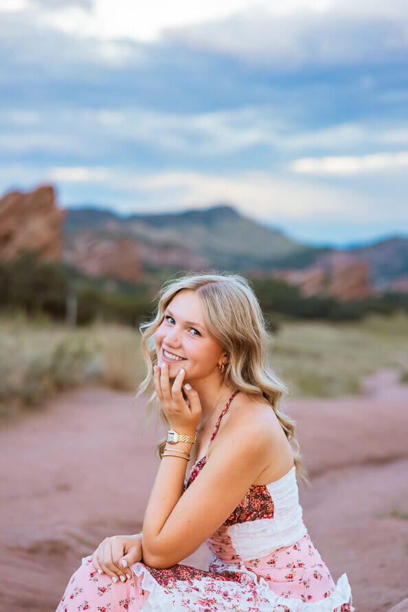 Girl laughs and hold on to chin for her photo session.