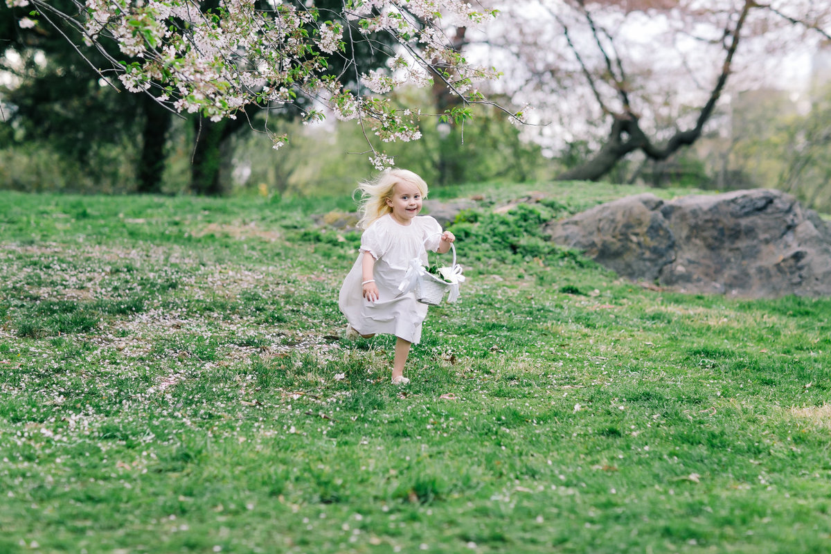 blonde little girl running in Central park