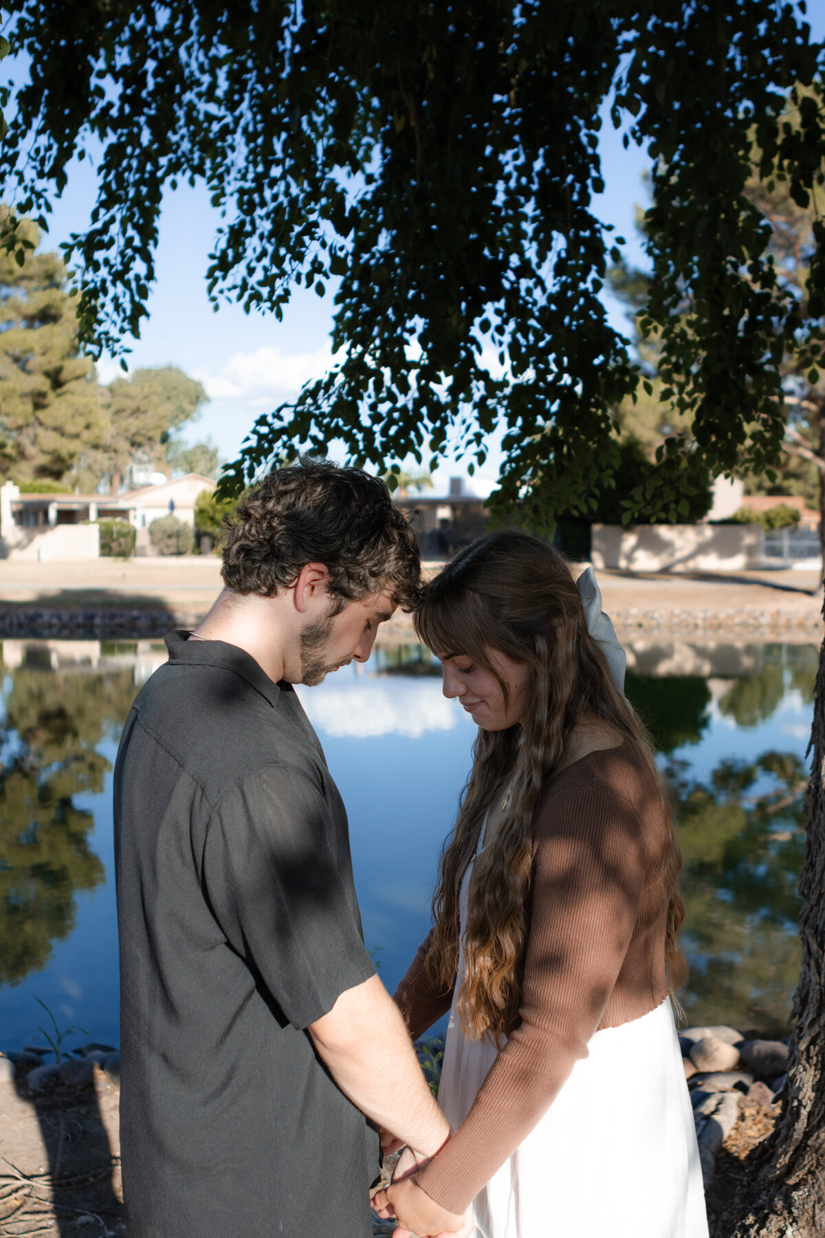 Jovanna G Photography. Classic, sophisticated Wedding Photos. Soft romantic engagement photos. Soft romantic WeddingPhotos. Sophisticated Wedding Photographer. Professional Wedding Photographer. Destination Wedding Photographer. Luxury Wedding photographer. Traveling Wedding Photographer. AZ Wedding Photographer. Gilbert AZ Wedding Photographer. Queen Creek Wedding Photographer. Phoenix Wedding Photographer. Scottsdale Wedding Photographer. Flagstaff Wedding Photographer. SoCal Wedding Photographer. California Wedding Photographer. Northern California Wedding Photographer. Southern California Wedding Photographer. San Francisco Wedding Photographer. Bay Area Wedding Photographer. San Jose Wedding Photographer. Golden Gate Bridge Wedding Photographer. Beach Lover Wedding Photographer. Palace of the Fine Arts Wedding Photographer. Ocean Lover. I love California. Orange County Wedding Photographer. Newport Beach Couples Photographer. Newport Beach Wedding Photographer. Laguna Beach Couples Beach Engagement Photographer. Laguna Beach wedding beach photographer. Los Angeles Wedding Photographer. Young and in love engaged couples who live in southern California. Christian Young Couple. Young Engaged Couple. Engaged High School Christian Couple. Christian Values. Young conservative Christian women. Young Conservative Christian men. Young Conservative Christian Couple. Young Christian Couple Engaged in High School. Young Christian College Couple. Lakeside Lovers in the Autumn Sun. David & Grace - engagement photos. Jovanna G Photographer Engagement Photos. Arizona sun shining through autumn trees- engagement. Chandler, AZ Engagement Photos. Chandler, AZ 2026 bride. Chandler, AZ Wedding Photographer. Chandler, AZ Young Engaged Couple. Girl in her 20s. Engaged Arizona Girl in her 20s. Lakeside Engagement photos. AZ Lakeside Engagement Photos. AZ Weeping Willow Lakeside Proposal. Arizona Lakeside Proposal with weeping willow tree. Detail shot of engagement ring on Arizona Lakeside estate. Chandler, AZ Lakeside Estate Proposal Outfit Inspiration.