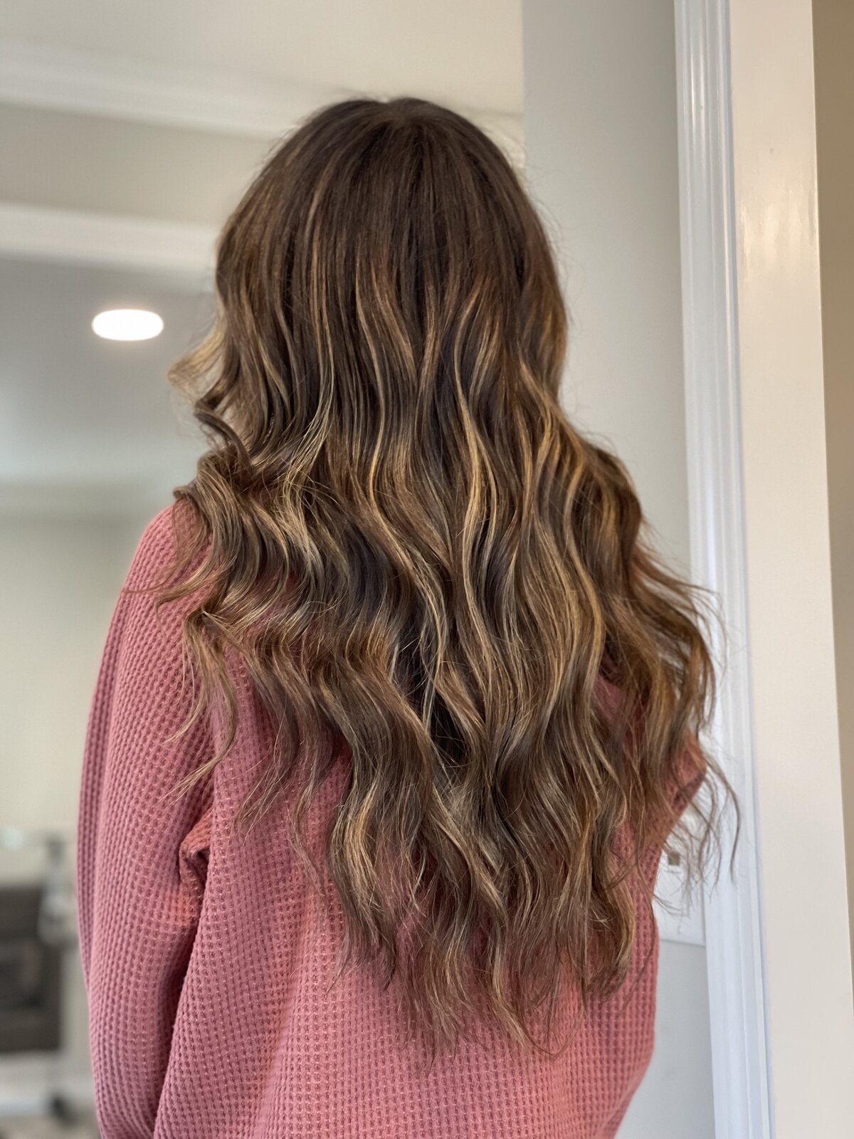 warm blonde balayage highlights on brunette hair