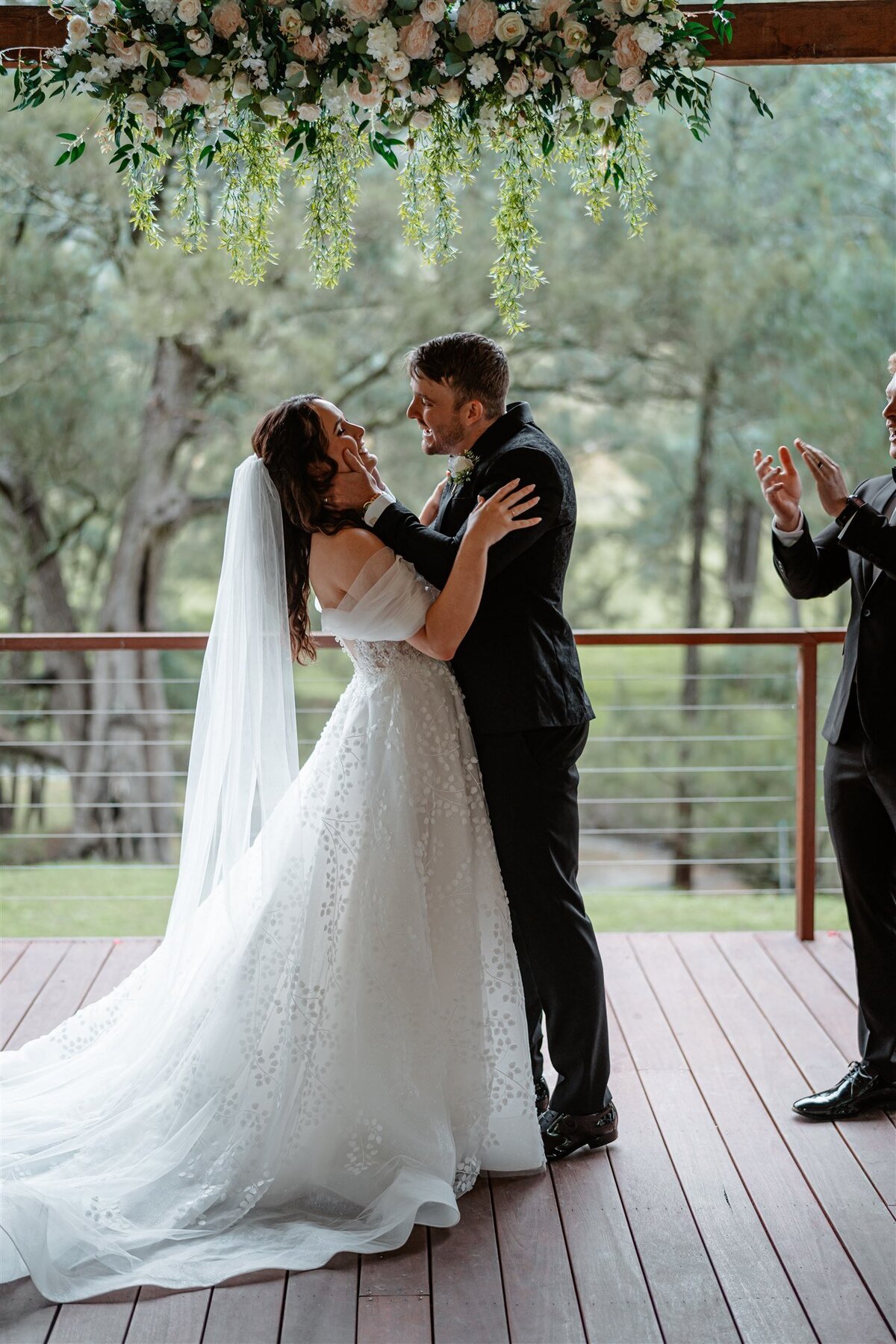 A couple shares their first kiss as husband and wife during the ceremony.