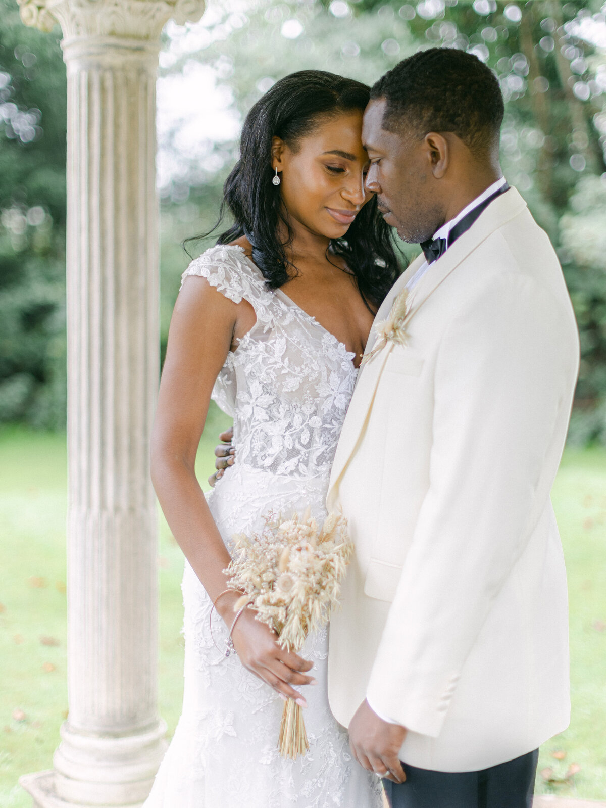 Kayla Stoate Ardington House Oxfordshire Wedding Bride Groom Military Flowers Smiling Sword