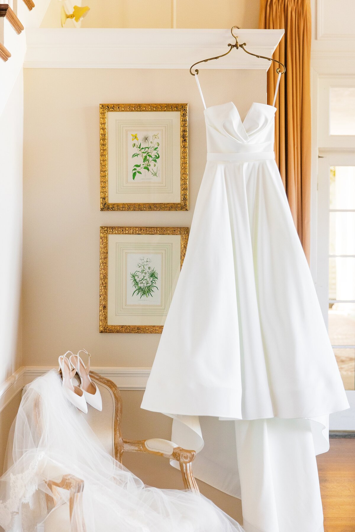 styled detail shot of the bride's dress, shoes, and veil