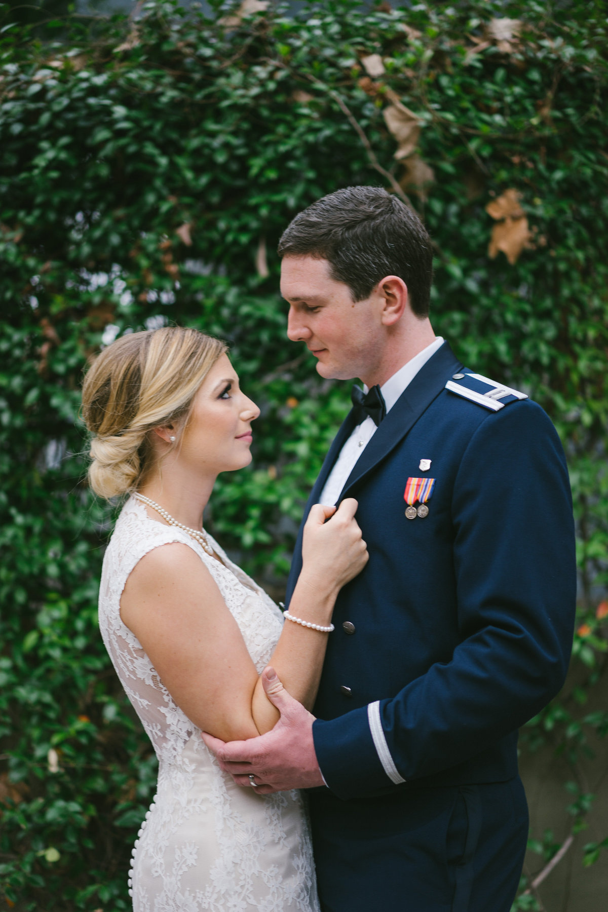 Bride pulling her groom closer to her and looking deep into his eyes after their wedding ceremony at St. Sophia Greek Orthodox Church in San Antonio