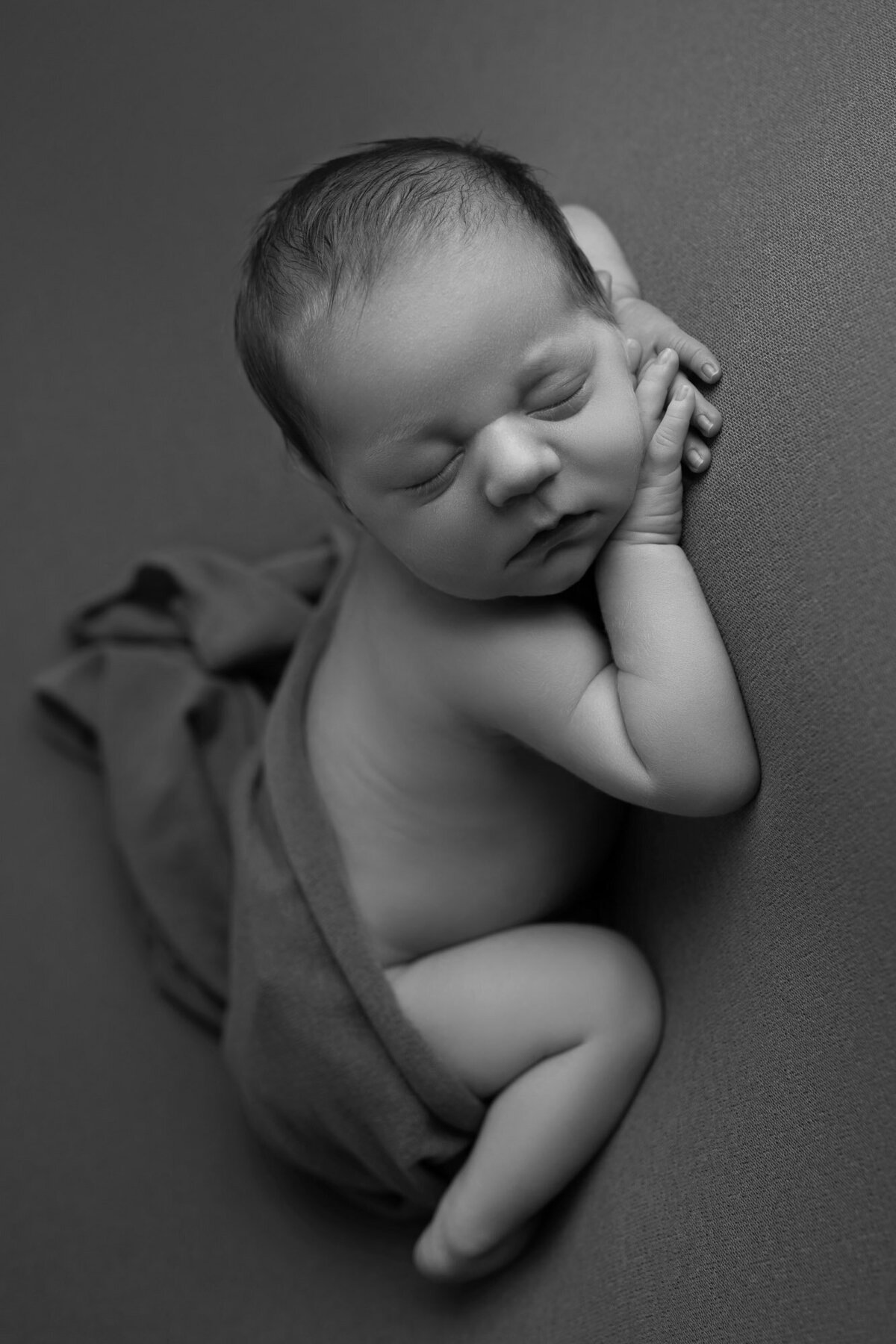 Black white newborn classic pose Cedar Park artistic baby photographer