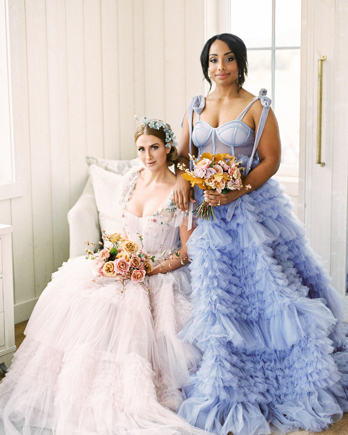 Bride and bridemaid  in colorful dresses