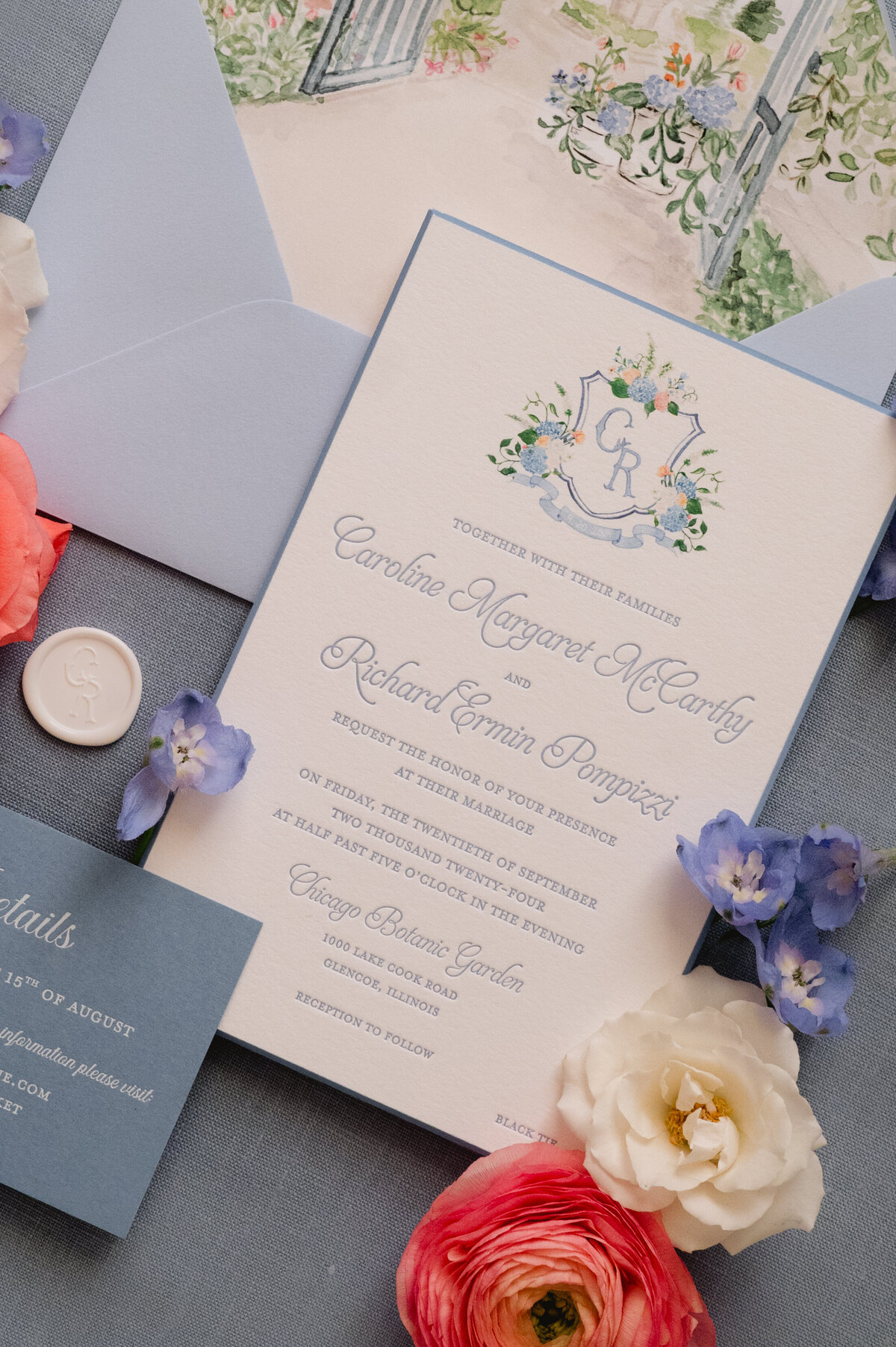 Detailed view of a wedding invitation with floral envelope liner.