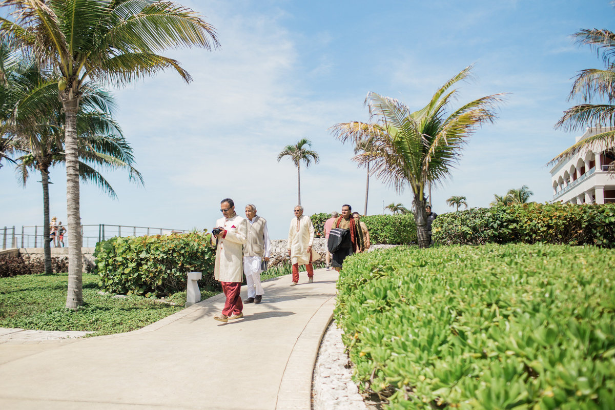 Cancun destination wedding guests make their way to the ceremony.  Photo by Rebecca Cerasani.