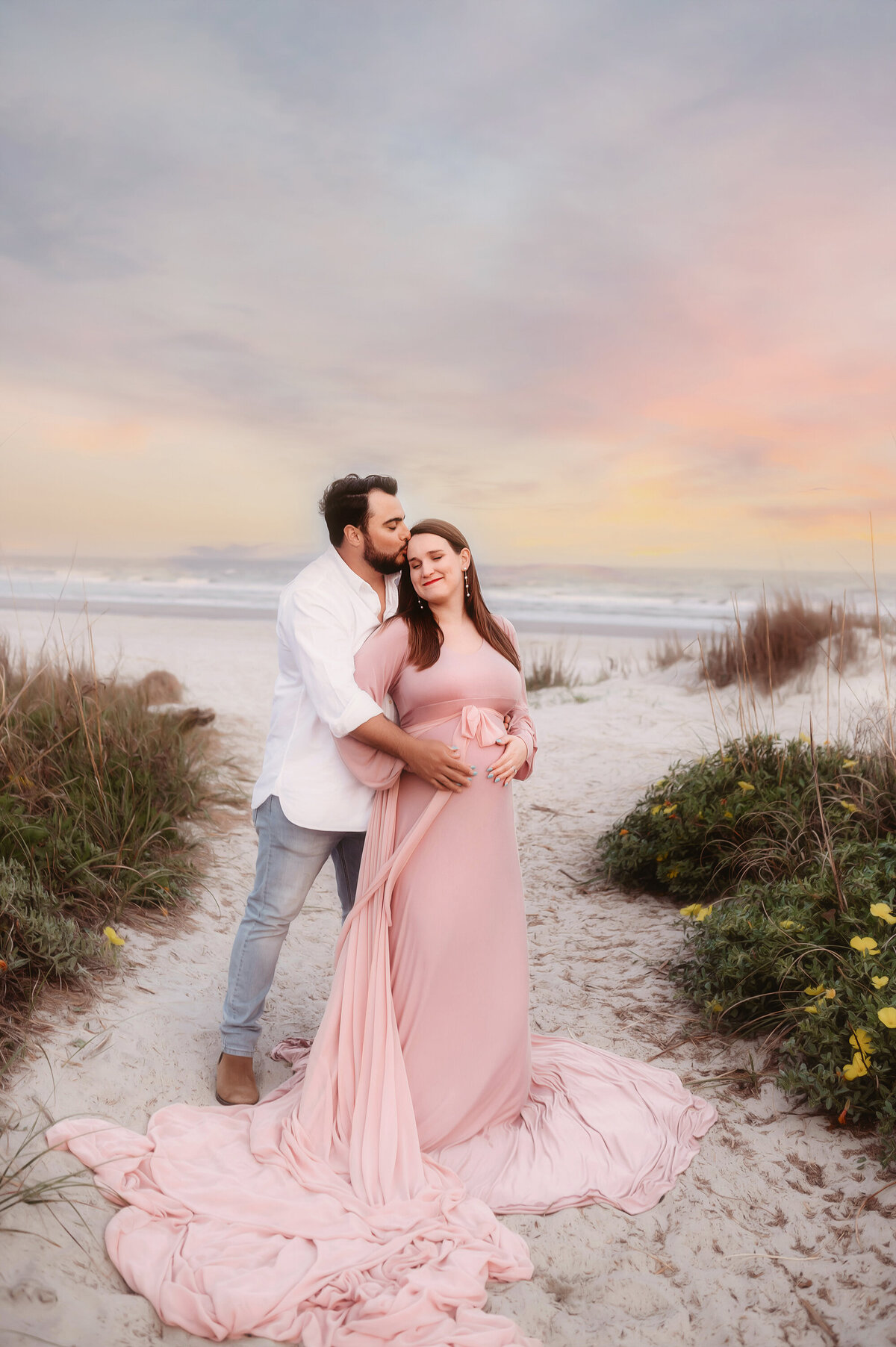 During their Babymoon in Charleston, expectant parents pose for Beach Maternity Photos in Charleston, SC.