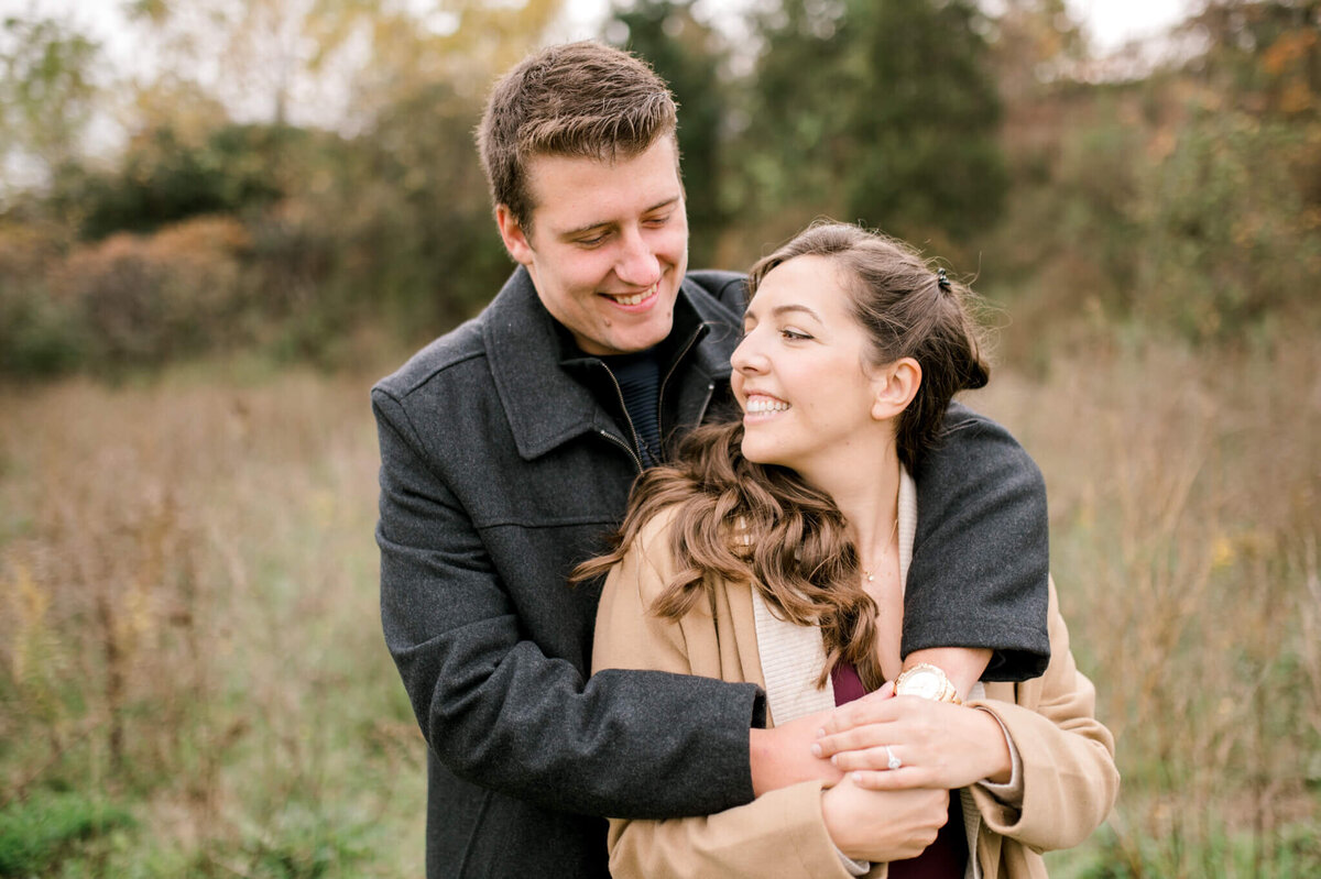 Couple in a field for their Toronto engagement session