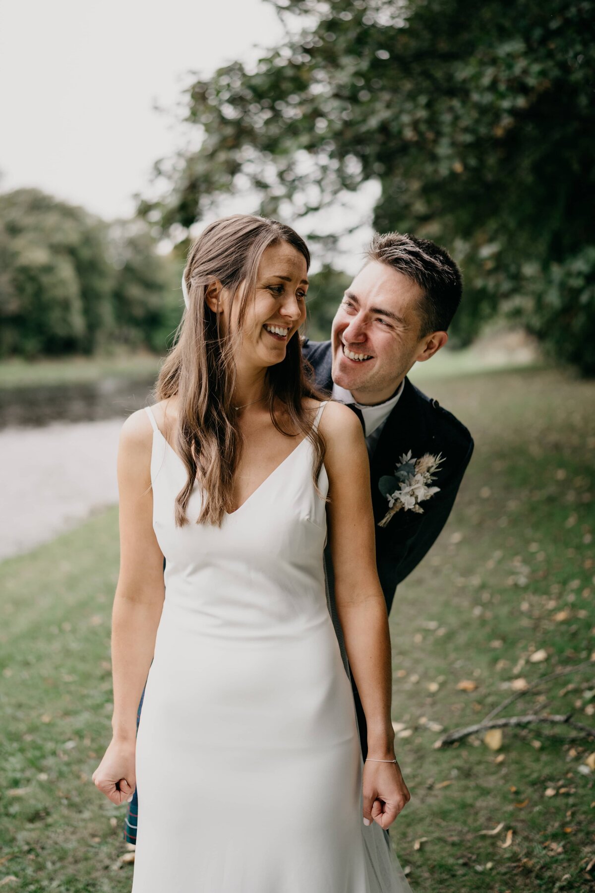 A relaxed candid wedding portrait of a bride and groom at Banchory Lodge Hotel.