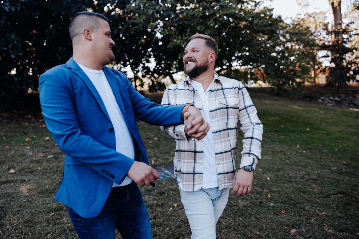 Nashville engagement photographer captures couple walking holding hands