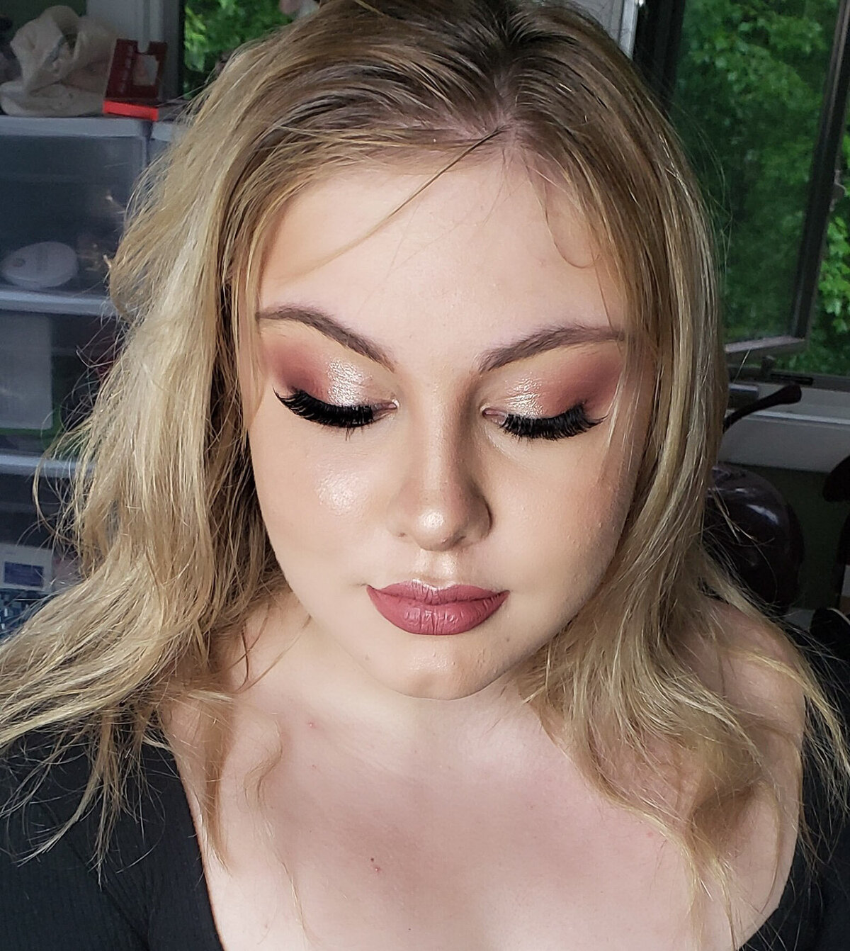 Glamorous beauty portrait featuring full lashes and warm tones – Fairfield County makeup session.