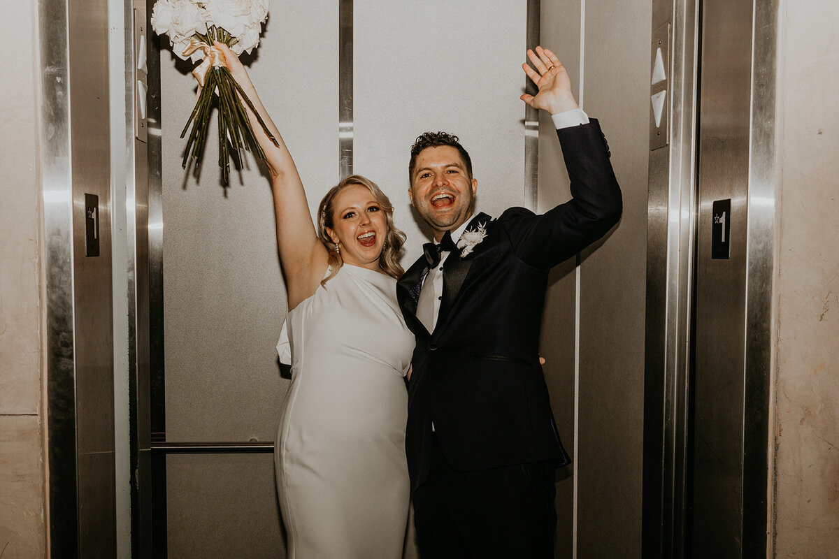 bride and groom in an elevator in downtown Knoxville