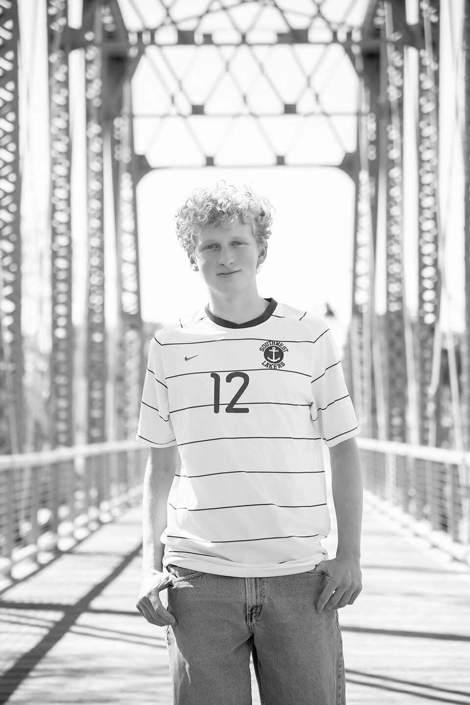 senior-mens-soccer-player-portriat-on-bridge