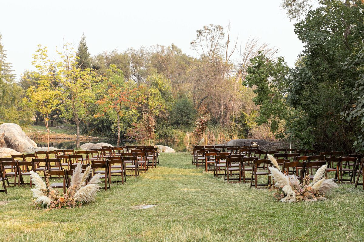 wedding ceremony chairs in front of lake