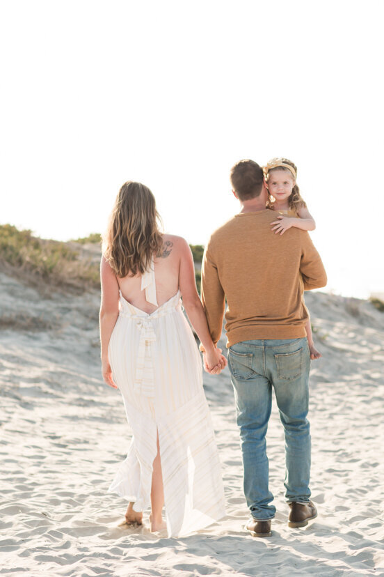 parents-and-daughter-walking-in-Coronado-sand-dunes-san-diego