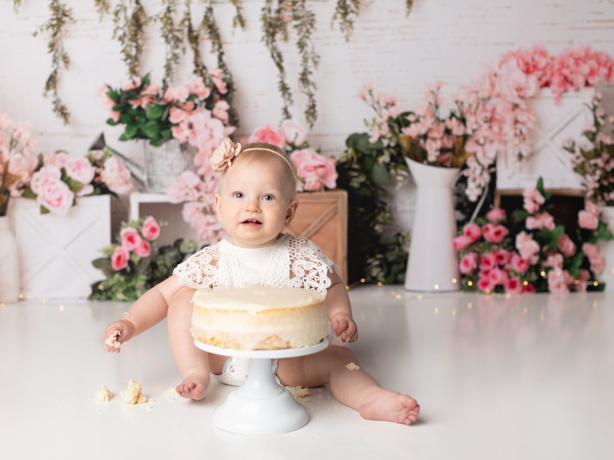 one year old girl birthday photoshoot with floral background