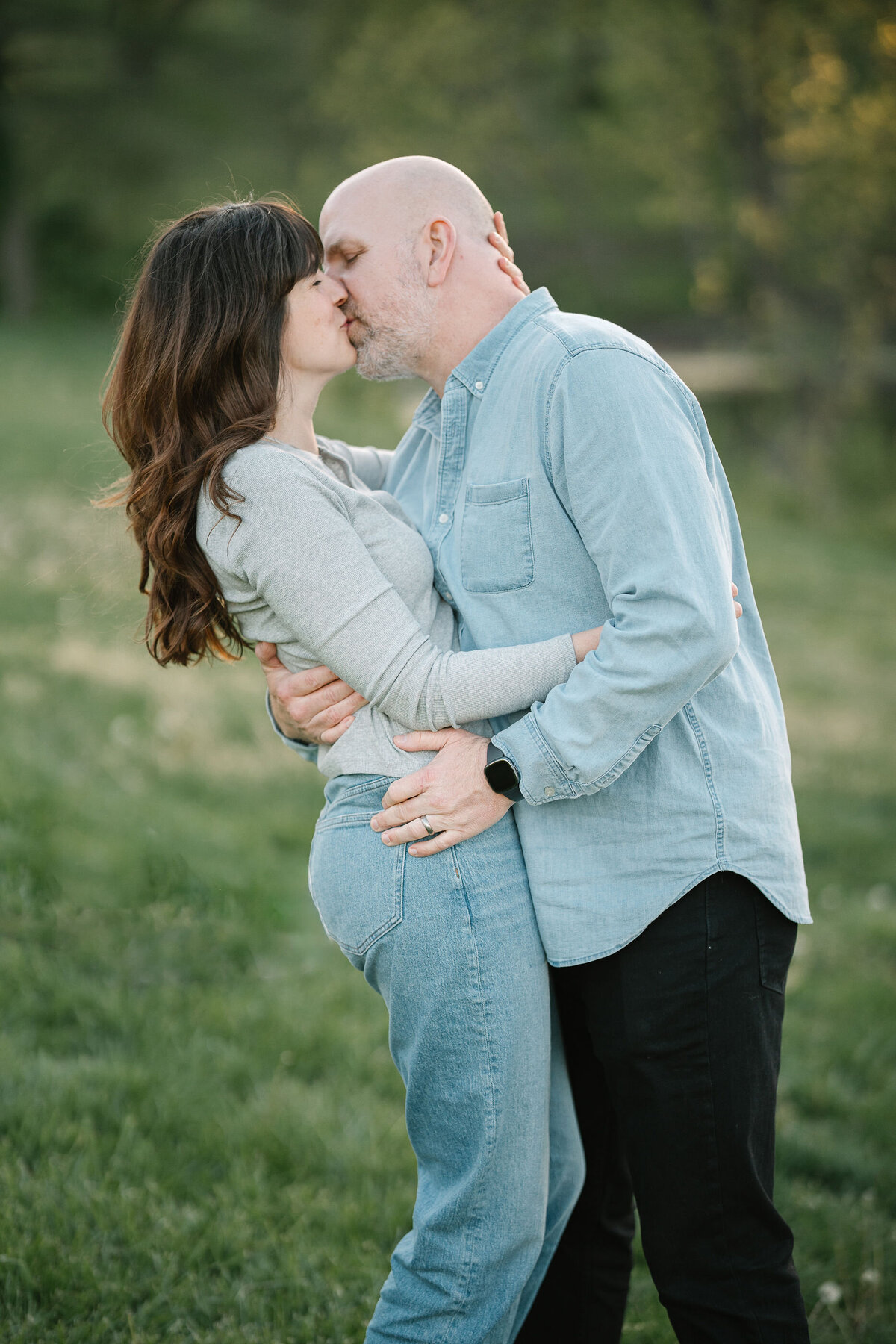 A couple holding each other and kissing 