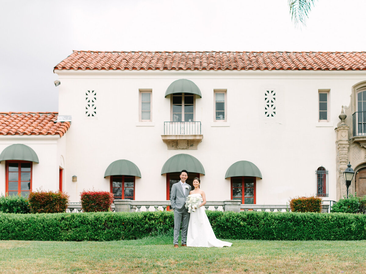 muckenthaler mansion wedding photography of bride and groom in front of the mansion